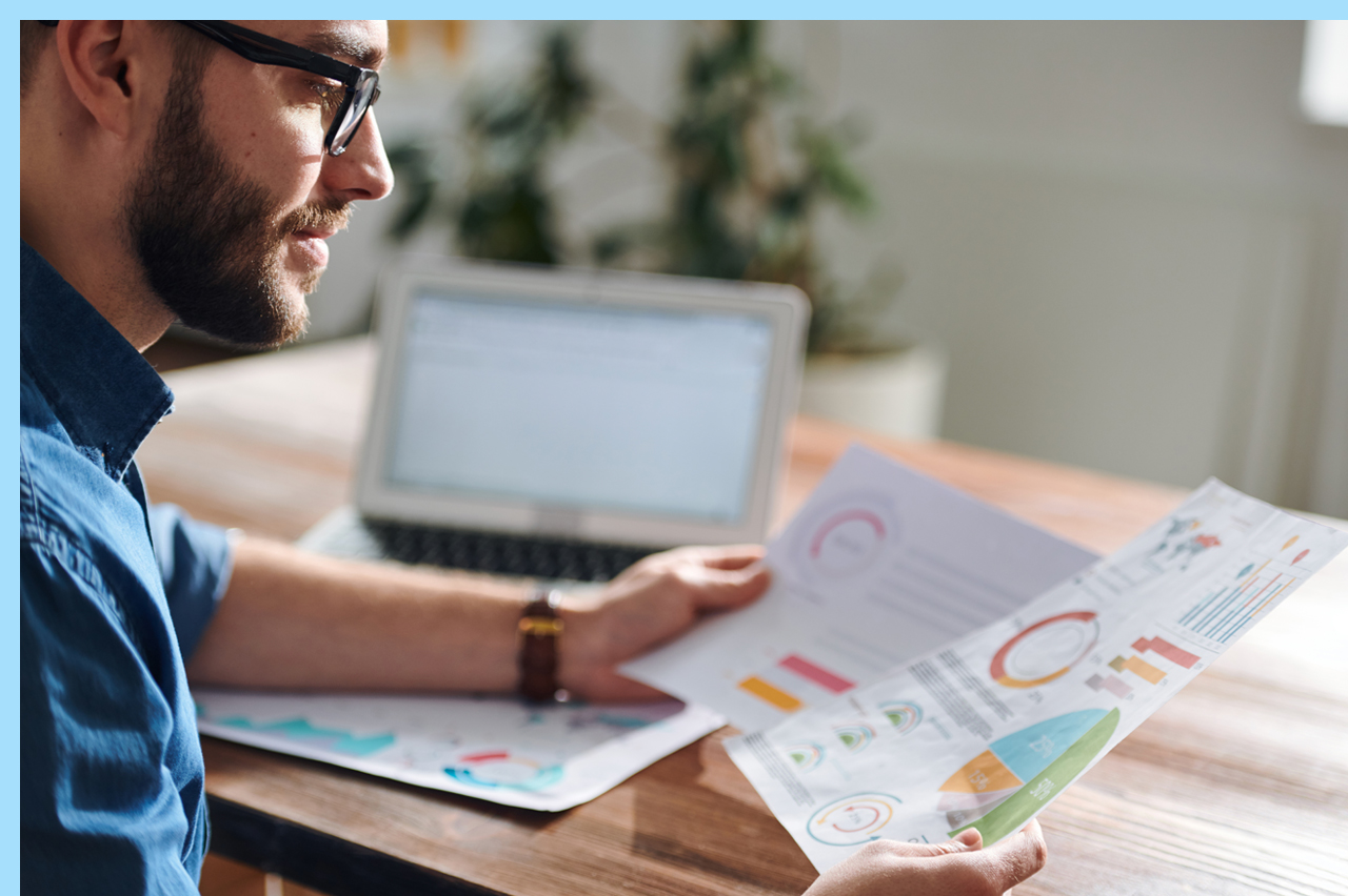 man looking over marketing plan