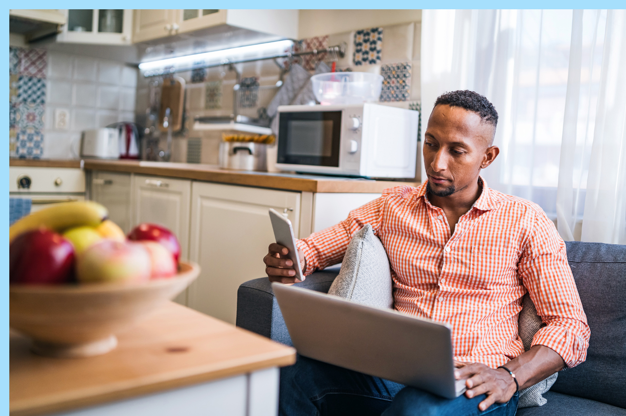 man at home researching online