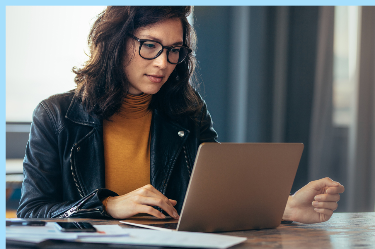 women looking through her laptop