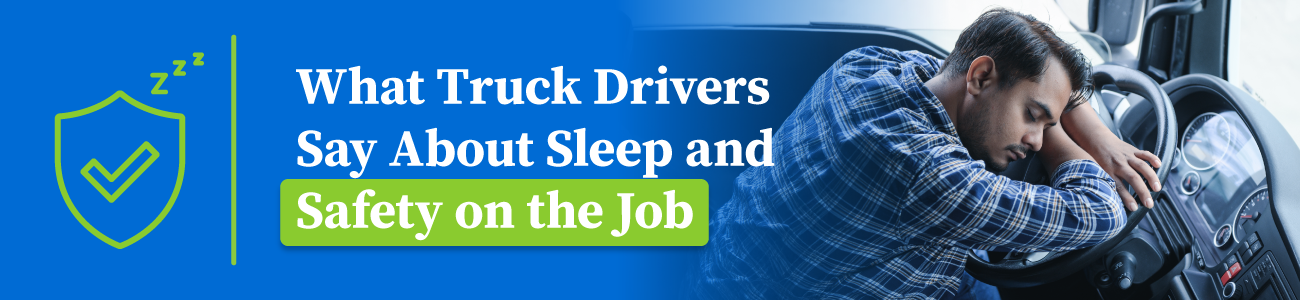 Truck driver eating a snack while sitting in a parked truck.